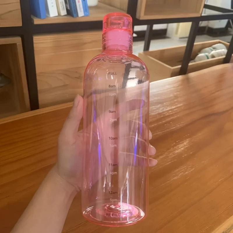 Transparent Pink Plastic Water Bottle, Minimalist Pink Drinking Bottle, Sleek Transparent Hydration Bottle.