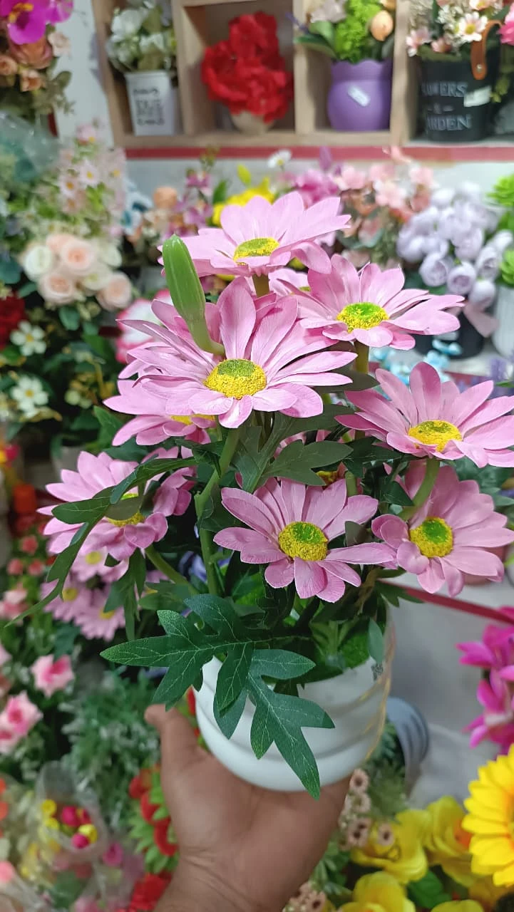 Artificial Flower Top Highlights the soft, charming pink hue of the petals.